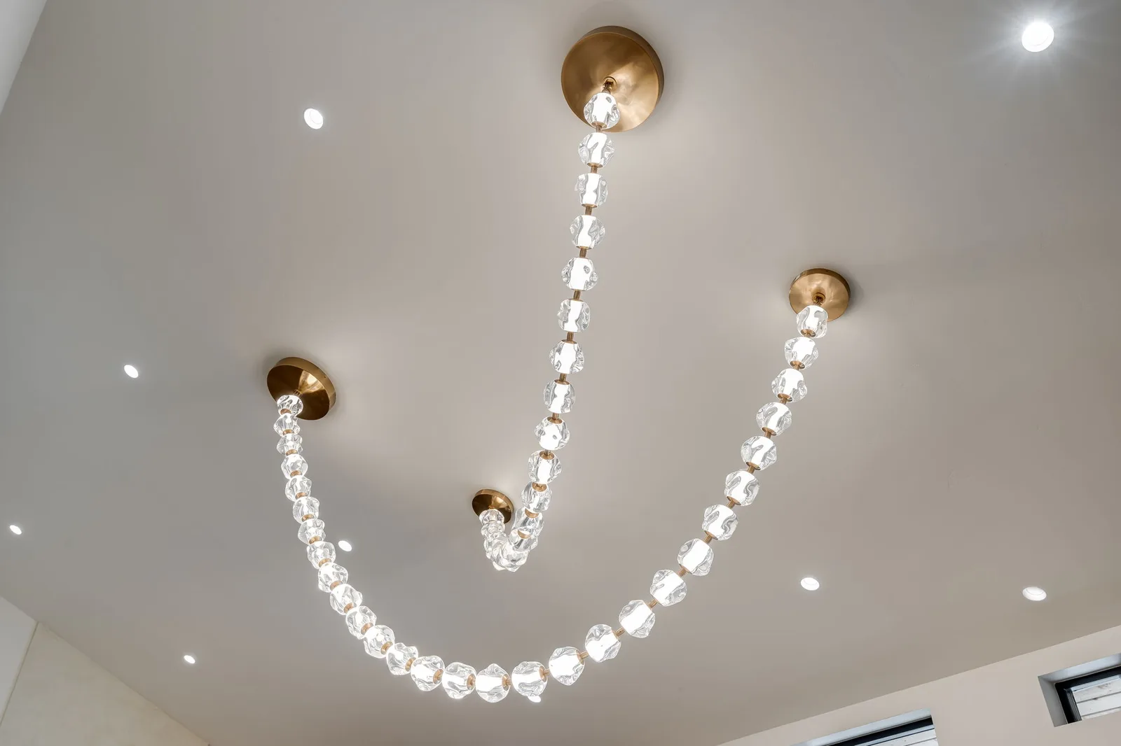 Brass and crystal pearl chandelier detail