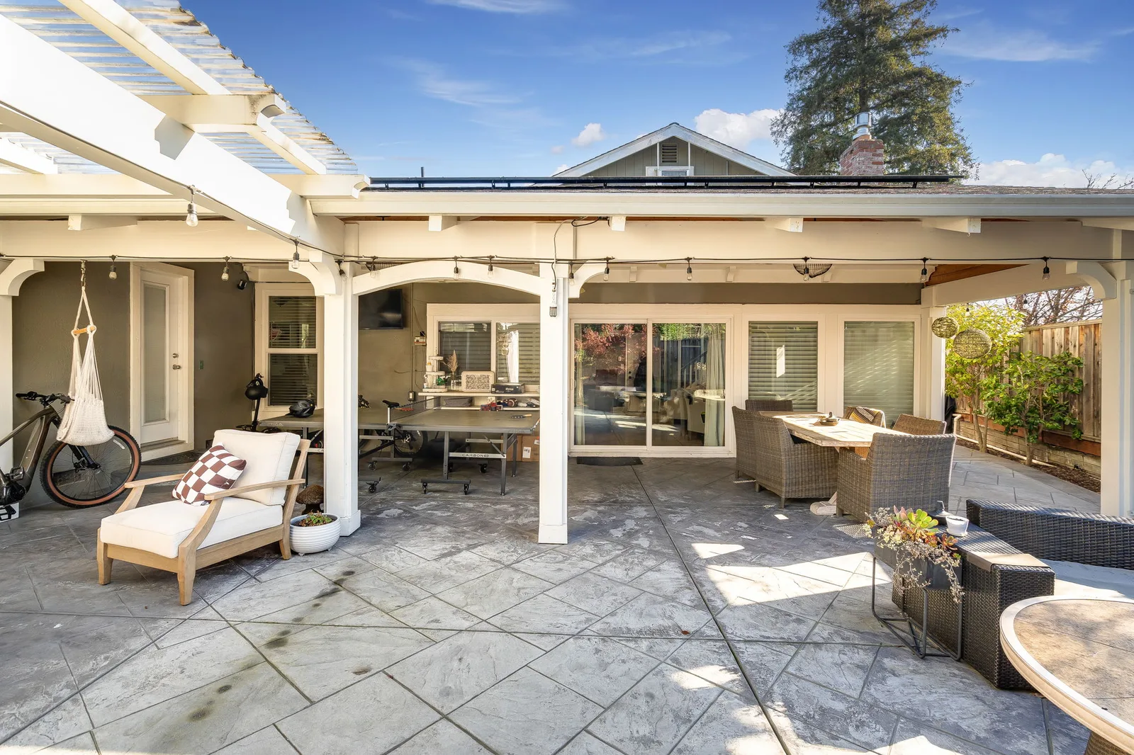 Stamped concrete patio with pergola and outdoor living area